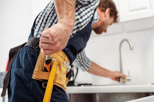 A plumber in Springfield, MO that is using high-end tools to restore the water flow in a residential home with backflow testing services.